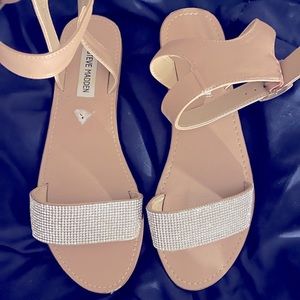 Steve Madden. Tan sandals with silver rhinestones. Strap goes around the ankle.